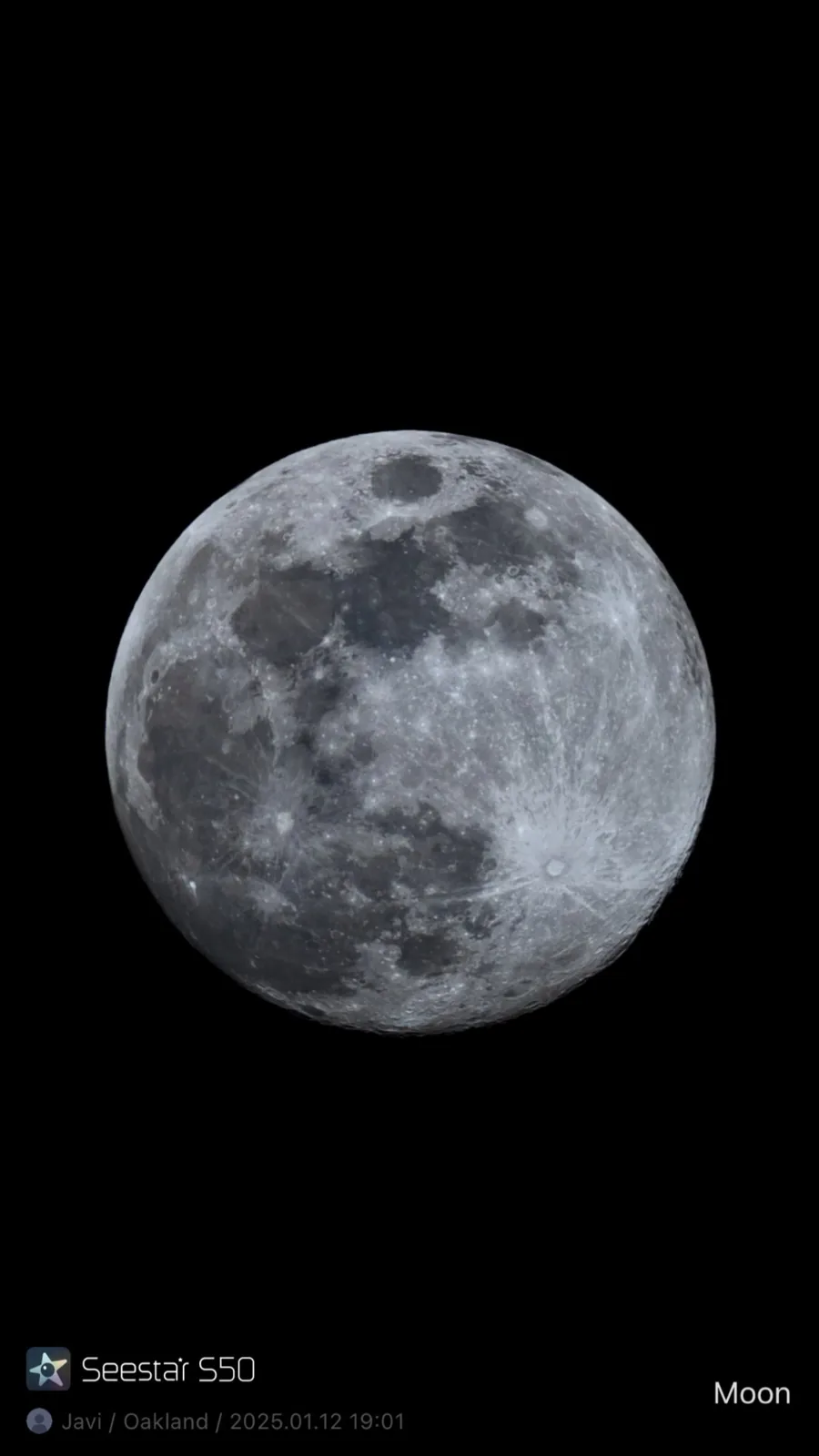 Monochrome full Moon against a black background, showing cratered terrain, bright highlands, and broad dark maria.